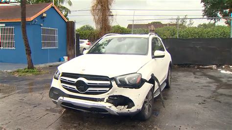 Car thieves caught on camera driving stolen SUV through gate of dealership